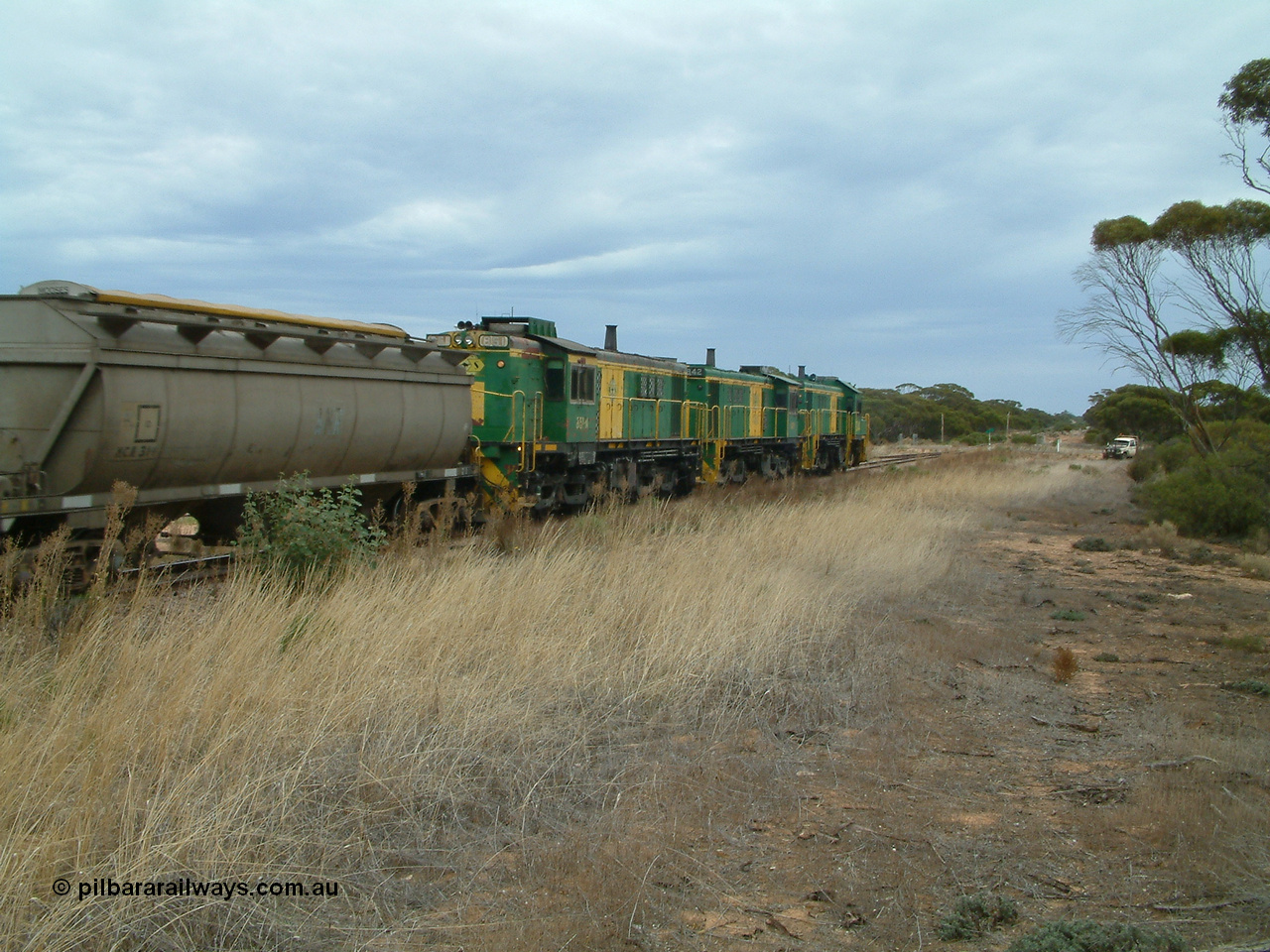 030407 092840
Yaninee, trailing view of an empty grain train behind a trio of former Australian National Co-Co locomotives with rebuilt former AE Goodwin ALCo model DL531 830 class ex 839, serial no. 83730, rebuilt by Port Augusta Workshops to DA class, leading two AE Goodwin ALCo model DL531 830 class units 842, serial no. 84140 and 851 serial no. 84137, 851 having been on the Eyre Peninsula since delivered in 1962, running express on the mainline. 7th April, 2003.
Keywords: DA-class;DA4;83730;Port-Augusta-WS;ALCo;DL531G/1;830-class;839;rebuild;