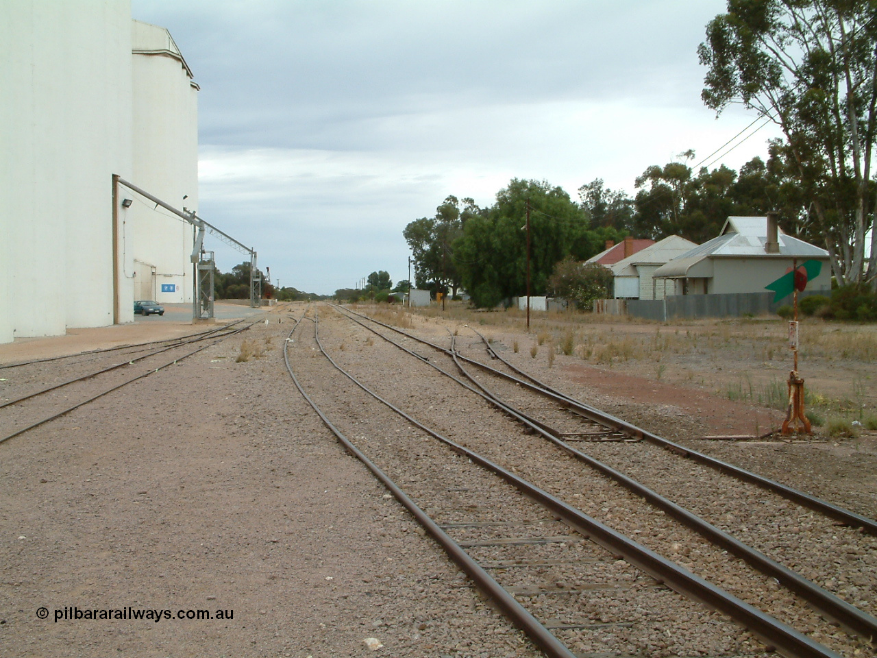 030407 094220
Minnipa, station yard view looking north down No. 3 Road, crossover for grain siding and points for storage roads on the left, points, lever and indicator for No. 1 Road of mainline on the right. 7th April, 2003.
