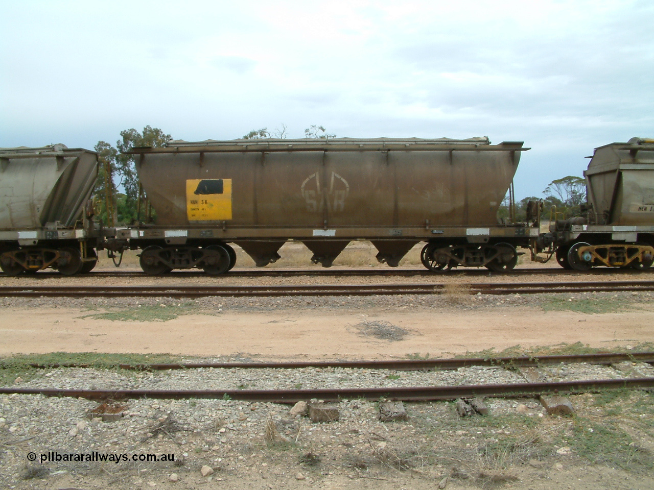 030407 105637
Poochera, track and side view of loaded SAR Islington Workshops built HAN type bogie wheat waggon HAN 3, note spoked wheel on right hand bogie. 7th April 2003.
Keywords: HAN-type;HAN3;1969-73/68-3;SAR-Islington-WS;