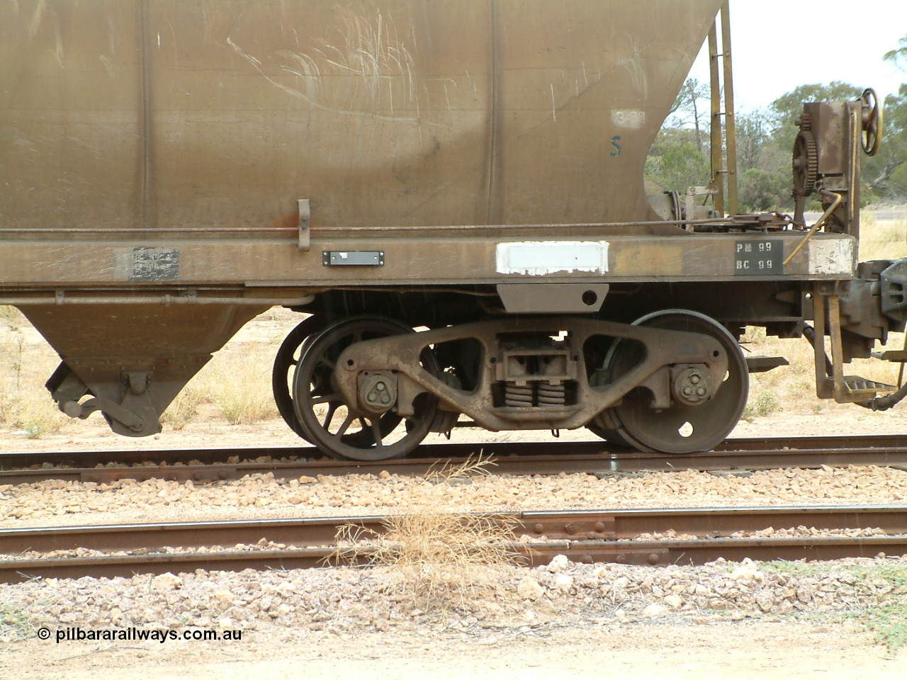 030407 105647
Poochera, detail view of the bogie with spoked axle set on loaded SAR Islington Workshops built HAN type bogie wheat waggon HAN 3, also note handbrake detail. 7th April 2003.
Keywords: HAN-type;HAN3;1969-73/68-3;SAR-Islington-WS;