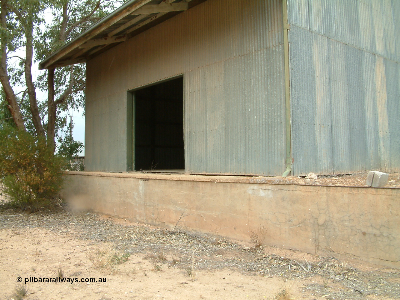 030407 105810
Poochera goods shed road vehicle side with platform and door.
