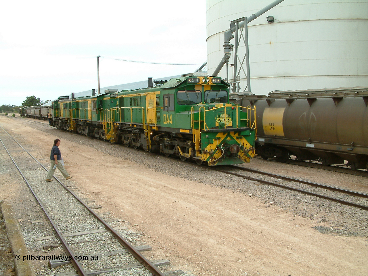 030407 120204
Poochera, trio of former Australian National locomotives with rebuilt former AE Goodwin ALCo model DL531 830 class ex 839 serial 83730 by Port Augusta Workshops to DA class DA 4 leading two AE Goodwin ALCo model DL531 830 class units 842 serial 84140 and 851 serial 84137, 851 having been on the Eyre Peninsula since delivered in 1962, as they run round the loaded ones to take south. 7th April 2003.
Keywords: DA-class;DA4;83730;Port-Augusta-WS;ALCo;DL531G/1;830-class;839;rebuild;