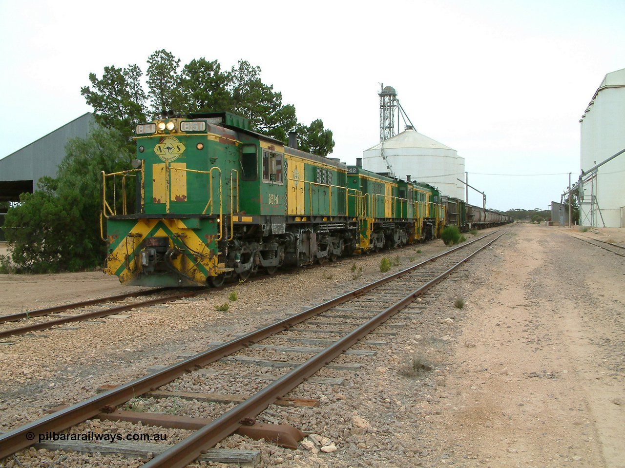 030407 120502
Poochera, the loaded train prepares to depart behind 830 class unit 851 AE Goodwin ALCo model DL531 serial 84137, 851 has spent its entire operating career on the Eyre Peninsula, it leads fellow 830 class 842 serial 84140 and a rebuilt unit DA 4, rebuilt from 830 class unit 839 by Port Augusta Workshops, retains original serial 83730 and model DL531.
Keywords: 830-class;851;AE-Goodwin;ALCo;DL531;84137;