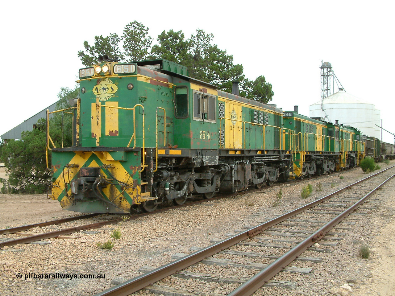 030407 120522
Poochera, the loaded train prepares to depart behind 830 class unit 851 AE Goodwin ALCo model DL531 serial 84137, 851 has spent its entire operating career on the Eyre Peninsula, it leads fellow 830 class 842 serial 84140 and a rebuilt unit DA 4, rebuilt from 830 class unit 839 by Port Augusta Workshops, retains original serial 83730 and model DL531.
Keywords: 830-class;851;84137;AE-Goodwin;ALCo;DL531;