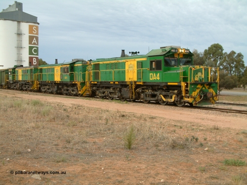 030407 082237
Wudinna, empty grain train behind a trio of former Australian National locomotives with rebuilt former AE Goodwin ALCo model DL531 830 class ex 839, serial 83730, rebuilt by Port Augusta Workshops to DA class, DA 4 leading two AE Goodwin ALCo model DL531 830 class units 842, serial 84140 and 851 serial 84137, 851 having been on the Eyre Peninsula since delivered in 1962, to shunt off empty waggons into the grain siding. April 7, 2003.
Keywords: DA-class;DA4;83730;Port-Augusta-WS;ALCo;DL531G/1;830-class;839;rebuild;