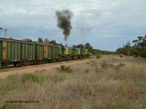 030407 082313
Wudinna, empty grain train shunts forward with a trio of former Australian National locomotives with rebuilt former AE Goodwin ALCo model DL531 830 class ex 839, serial 83730, rebuilt by Port Augusta Workshops to DA class, DA 4 leading two AE Goodwin ALCo model DL531 830 class units 842, serial 84140 and 851 serial 84137, 851 having been on the Eyre Peninsula since delivered in 1962, to shunt off empty waggons into the grain siding. April 7, 2003.
Keywords: DA-class;DA4;83730;Port-Augusta-WS;ALCo;DL531G/1;830-class;839;rebuild;