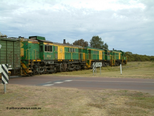 030407 082730
Wudinna, empty grain train shunts back across Gooch Tce grade crossing with a trio of former Australian National locomotives with rebuilt former AE Goodwin ALCo model DL531 830 class ex 839, serial 83730, rebuilt by Port Augusta Workshops to DA class, DA 4 leading two AE Goodwin ALCo model DL531 830 class units 842, serial 84140 and 851 serial 84137, 851 having been on the Eyre Peninsula since delivered in 1962. April 7, 2003.
Keywords: 830-class;851;AE-Goodwin;ALCo;DL531;84137;