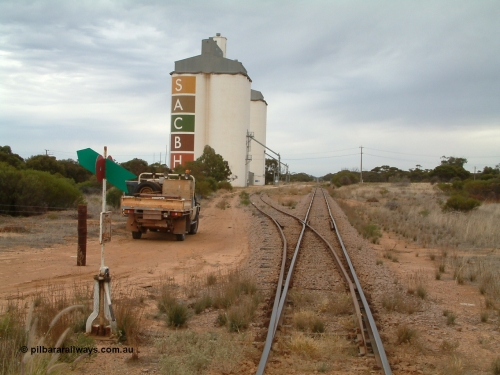 030407 085559
Yaninee, station yard overview looking north for the south end, concrete SACBH silo complexes, points, lever and indicator, mainline can be seen running straight into the distance. April 7, 2003.
