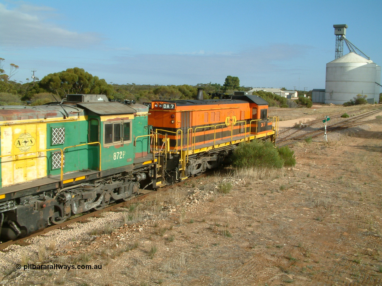 030409 084537
Kyancutta, empty grain train runs through the yard behind rebuild DA class unit DA 7 in Australian Southern orange and black livery leading a pair of AE Goodwin built ALCo model DL531 830 class units 872 and 871 with a string of grain waggons.
Keywords: DA-class;DA7;83713;Port-Augusta-WS;ALCo;DL531G/1;48-class;4813;rebuild;