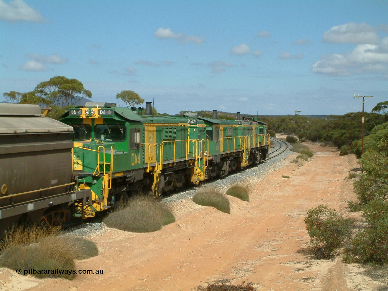 030409 110624
Caralue, loaded grain train working south of the former station site 830 class unit 851 AE Goodwin ALCo model DL531 serial 84137, 851 has spent its entire operating career on the Eyre Peninsula, it leads fellow 830 class 842 serial 84140 and a rebuilt unit DA 4, rebuilt from 830 class unit 839 by Port Augusta Workshops, retains original serial 83730 and model DL531.
Keywords: 830-class;851;84137;AE-Goodwin;ALCo;DL531;