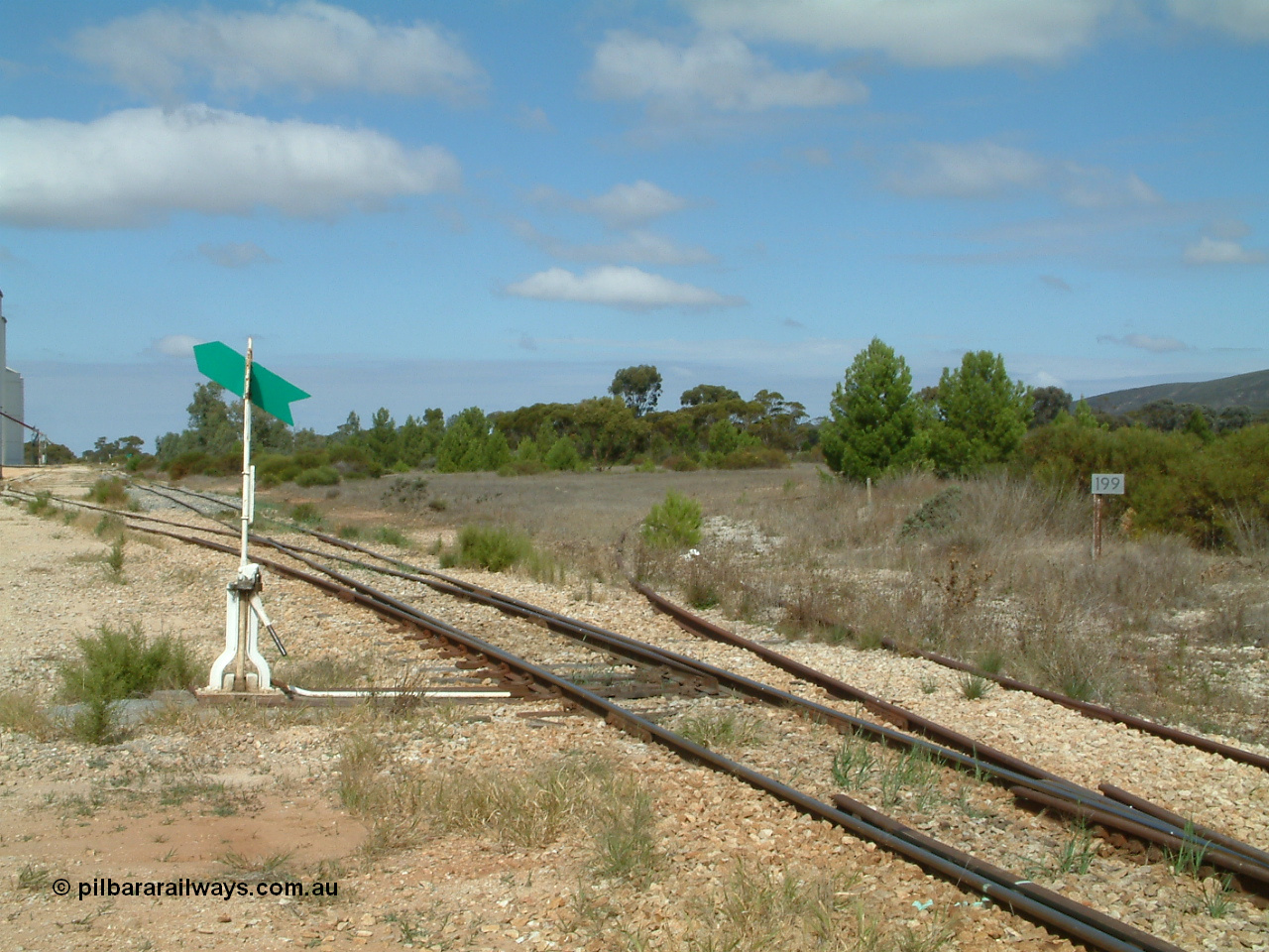 030409 111927
Darke Peake, yard overview looking at the north leg of the triangle curve away to the west, 199 km post, points and lever for the goods and grain siding.
