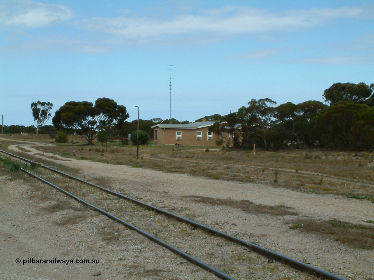 030409 124502
Rudall, view across the mainline looking at the crew barracks built new circa 1960 with the remains of a standpipe, possible for watering ballast.
