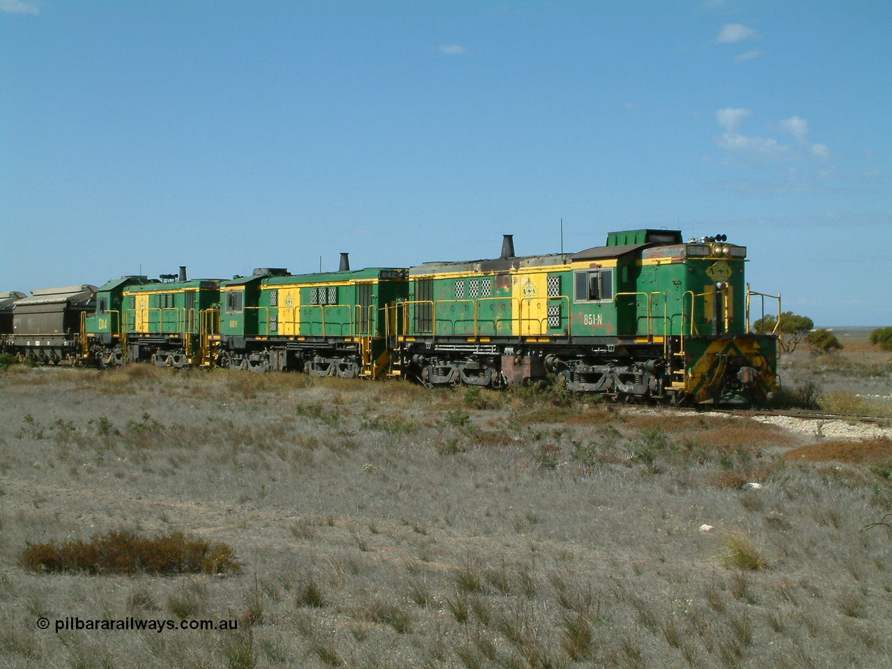 030409 140605
Wharminda, loaded grain train arrives behind 830 class unit 851 AE Goodwin ALCo model DL531 serial 84137, 851 has spent its entire operating career on the Eyre Peninsula, with fellow 830 class 842 serial 84140 and a rebuilt unit DA 4 as they stop to pick up loaded waggons.
Keywords: 830-class;851;84137;AE-Goodwin;ALCo;DL531;