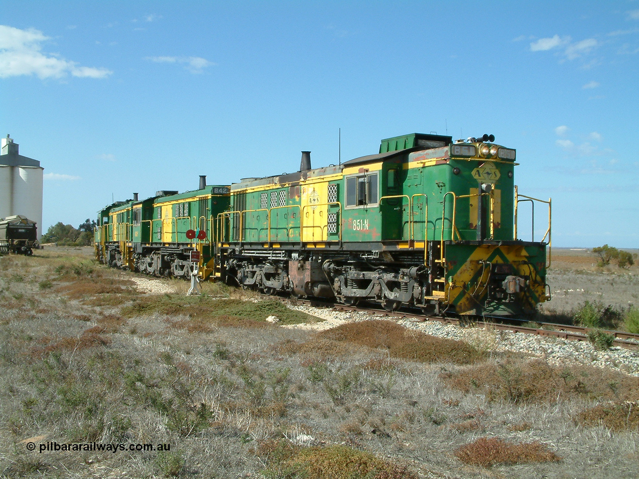 030409 140809
Wharminda, the engines 830 class unit 851 AE Goodwin ALCo model DL531 serial 84137, fellow 830 class 842 serial 84140 and a rebuilt unit DA 4 shunt back into the grain loop to pick up loaded waggons.
Keywords: 830-class;851;84137;AE-Goodwin;ALCo;DL531;