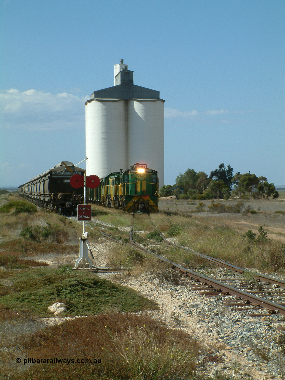 030409 141326
Wharminda, the engines 830 class unit 851 AE Goodwin ALCo model DL531 serial 84137, fellow 830 class 842 serial 84140 and a rebuilt unit DA 4 shunt back out of the siding for the mainline with the loaded waggons.
Keywords: 830-class;851;84137;AE-Goodwin;ALCo;DL531;