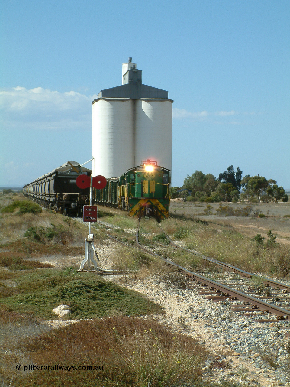 030409 141329
Wharminda, the engines 830 class unit 851 AE Goodwin ALCo model DL531 serial 84137, fellow 830 class 842 serial 84140 and a rebuilt unit DA 4 shunt back out of the siding for the mainline with the loaded waggons.
Keywords: 830-class;851;84137;AE-Goodwin;ALCo;DL531;