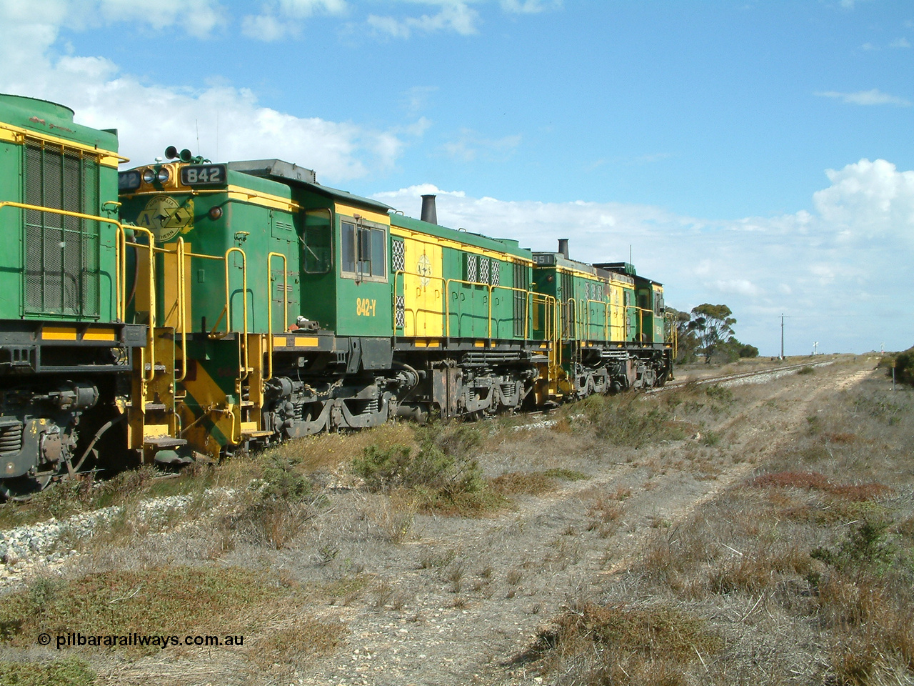 030409 141406
Wharminda, the engines 830 class unit 851 AE Goodwin ALCo model DL531 serial 84137, fellow 830 class 842 serial 84140 and a rebuilt unit DA 4 shunt along the mainline with the loaded waggons.
Keywords: 830-class;842;84140;AE-Goodwin;ALCo;DL531;