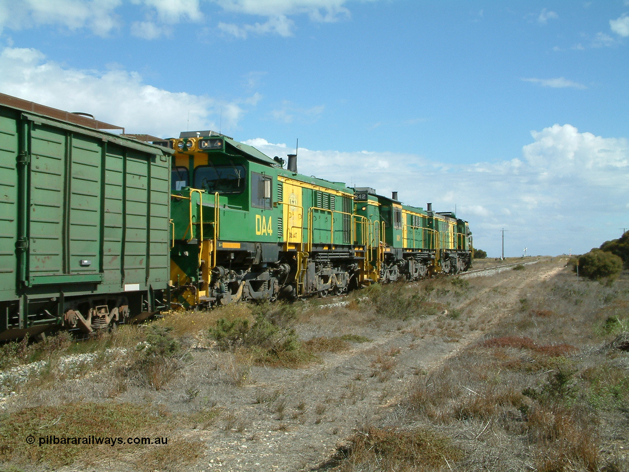 030409 141411
Wharminda, the engines 830 class unit 851 AE Goodwin ALCo model DL531 serial 84137, fellow 830 class 842 serial 84140 and a rebuilt unit DA 4 shunt along the mainline with the loaded waggons.
Keywords: DA-class;DA4;83730;Port-Augusta-WS;ALCo;DL531G/1;830-class;839;rebuild;