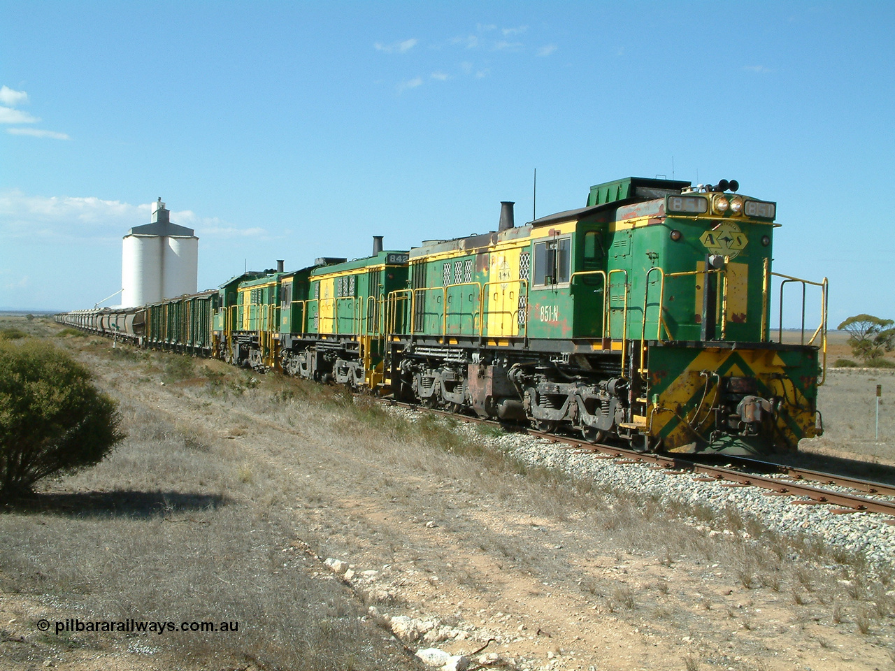 030409 141620
Wharminda, loaded grain train prepares to depart having attached extra loading behind 830 class unit 851 AE Goodwin ALCo model DL531 serial 84137, 851 has spent its entire operating career on the Eyre Peninsula, with fellow 830 class 842 serial 84140 and a rebuilt unit DA 4.
Keywords: 830-class;851;84137;AE-Goodwin;ALCo;DL531;