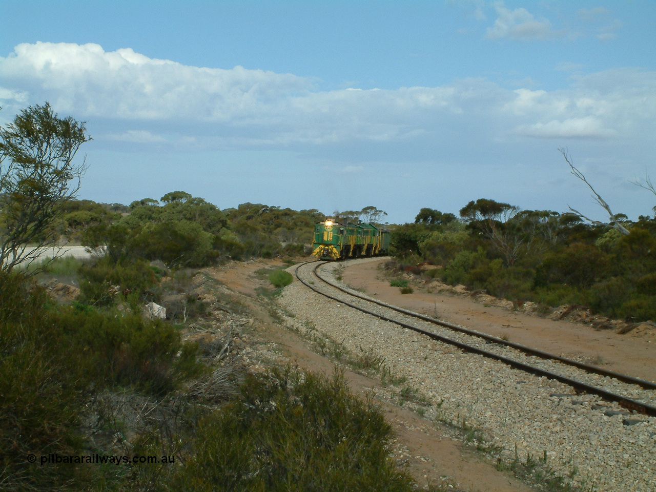 030409 153916
Moody Tank, a loaded grain train storms around the curve behind 830 class unit 851 AE Goodwin ALCo model DL531 serial 84137, fellow 830 class 842 serial 84140 and a rebuilt DA class unit DA 4.
Keywords: 830-class;851;84137;AE-Goodwin;ALCo;DL531;