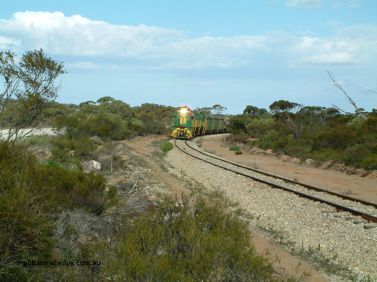 030409 153922
Moody Tank, a loaded grain train storms around the curve behind 830 class unit 851 AE Goodwin ALCo model DL531 serial 84137, fellow 830 class 842 serial 84140 and a rebuilt DA class unit DA 4.
Keywords: 830-class;851;84137;AE-Goodwin;ALCo;DL531;