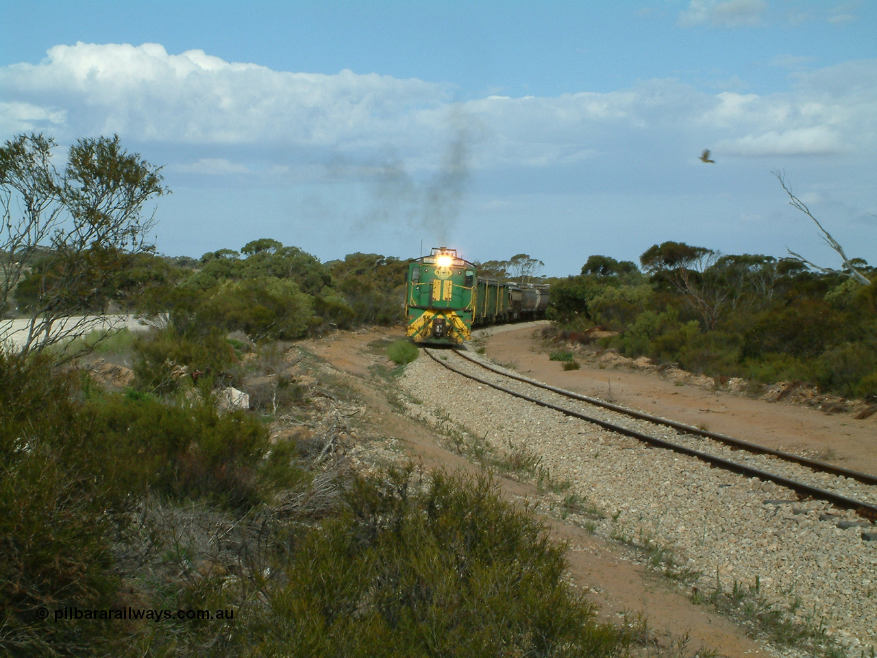 030409 153926
Moody Tank, a loaded grain train storms around the curve behind 830 class unit 851 AE Goodwin ALCo model DL531 serial 84137, fellow 830 class 842 serial 84140 and a rebuilt DA class unit DA 4.
Keywords: 830-class;851;84137;AE-Goodwin;ALCo;DL531;