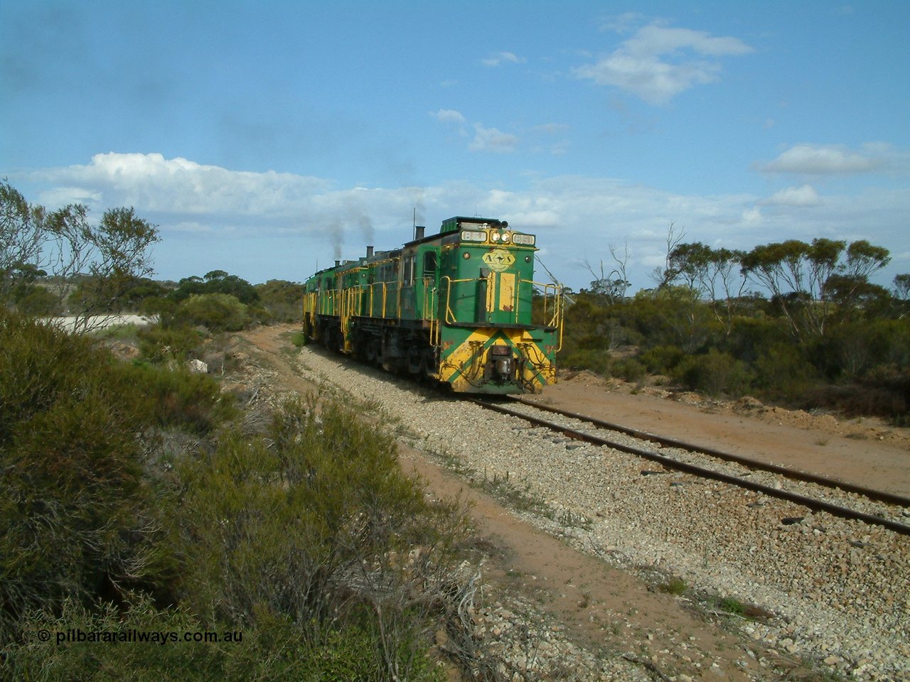 030409 153937
Moody Tank, a loaded grain train storms around the curve behind 830 class unit 851 AE Goodwin ALCo model DL531 serial 84137, fellow 830 class 842 serial 84140 and a rebuilt DA class unit DA 4.
Keywords: 830-class;851;84137;AE-Goodwin;ALCo;DL531;