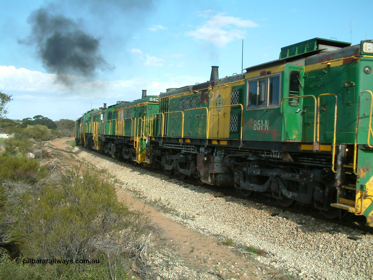 030409 153940
Moody Tank, a loaded grain train storms around the curve behind 830 class unit 851 AE Goodwin ALCo model DL531 serial 84137, fellow 830 class 842 serial 84140 and a rebuilt DA class unit DA 4.
Keywords: 830-class;851;84137;AE-Goodwin;ALCo;DL531;