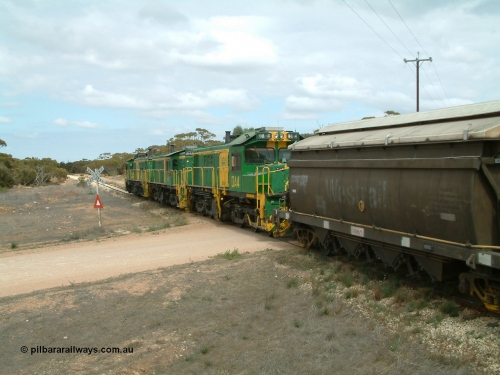 030409 115618
Darke Peake, at the 195 km Dog Fence Road grade crossing loaded grain train with 830 class unit 851 AE Goodwin ALCo model DL531 serial 84137, 851 has spent its entire operating career on the Eyre Peninsula, leads fellow 830 class 842 serial 84140 and a rebuilt unit DA 4, rebuilt from 830 class unit 839 by Port Augusta Workshops, retains original serial 83730 and model DL531 with the first twelve waggons behind the locos XNW type.
Keywords: DA-class;DA4;83730;Port-Augusta-WS;ALCo;DL531G/1;830-class;839;rebuild;