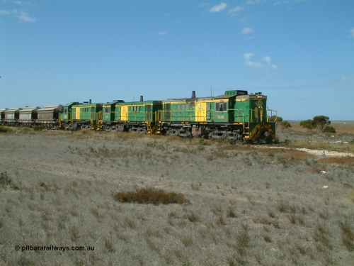030409 140546
Wharminda, loaded grain train arrives behind 830 class unit 851 AE Goodwin ALCo model DL531 serial 84137, 851 has spent its entire operating career on the Eyre Peninsula, with fellow 830 class 842 serial 84140 and a rebuilt unit DA 4 as they stop to pick up loaded waggons.
Keywords: 830-class;851;AE-Goodwin;ALCo;DL531;84137;