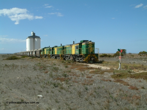 030409 140620
Wharminda, loaded grain train arrives behind 830 class unit 851 AE Goodwin ALCo model DL531 serial 84137, 851 has spent its entire operating career on the Eyre Peninsula, with fellow 830 class 842 serial 84140 and a rebuilt unit DA 4 as they stop to pick up loaded waggons.
Keywords: 830-class;851;AE-Goodwin;ALCo;DL531;84137;