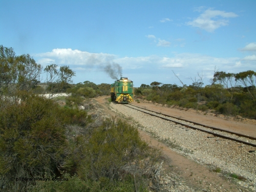 030409 153932
Moody Tank, a loaded grain train storms around the curve behind 830 class unit 851 AE Goodwin ALCo model DL531 serial 84137, fellow 830 class 842 serial 84140 and a rebuilt DA class unit DA 4.
Keywords: 830-class;851;AE-Goodwin;ALCo;DL531;84137;