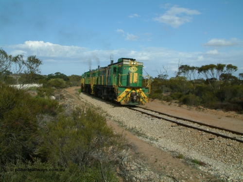 030409 153937
Moody Tank, a loaded grain train storms around the curve behind 830 class unit 851 AE Goodwin ALCo model DL531 serial 84137, fellow 830 class 842 serial 84140 and a rebuilt DA class unit DA 4.
Keywords: 830-class;851;AE-Goodwin;ALCo;DL531;84137;