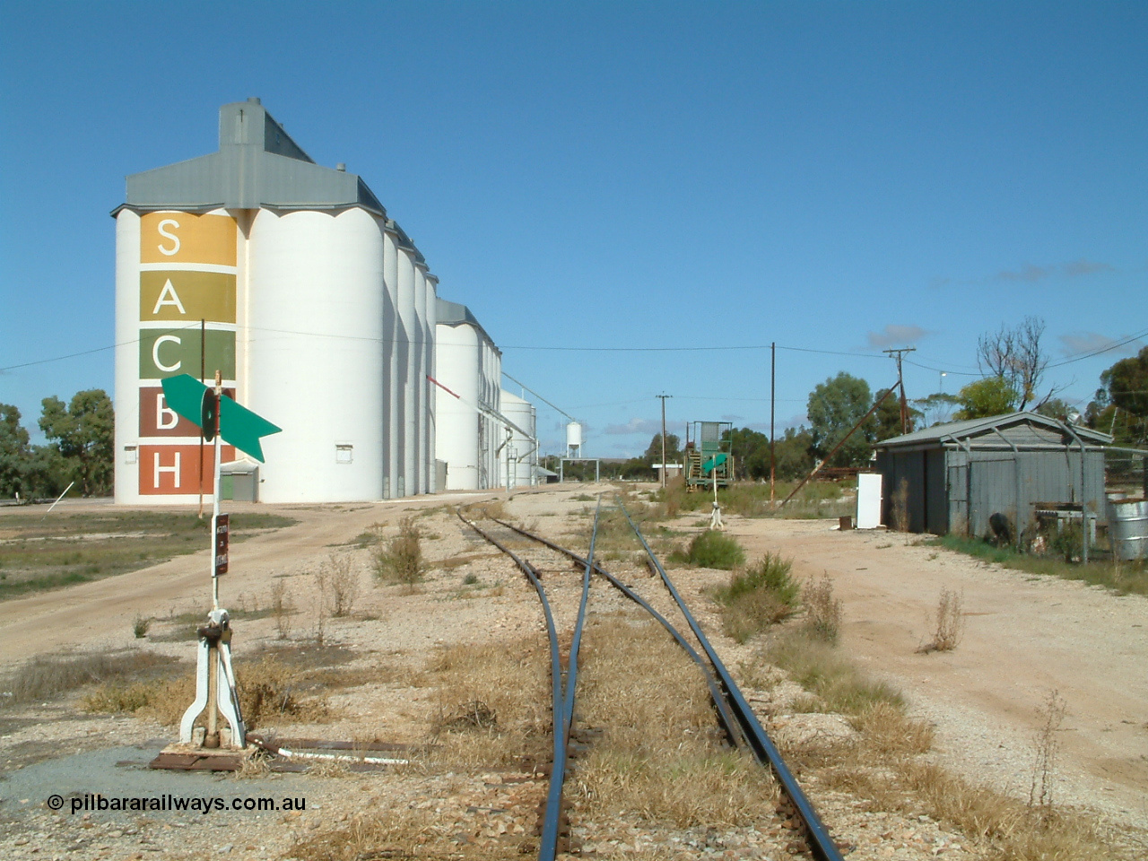 030411 105754
Kimba, station yard view looking south from Kimba Terrace, gang shed on the right, winch waggon visible and silos on the left.
