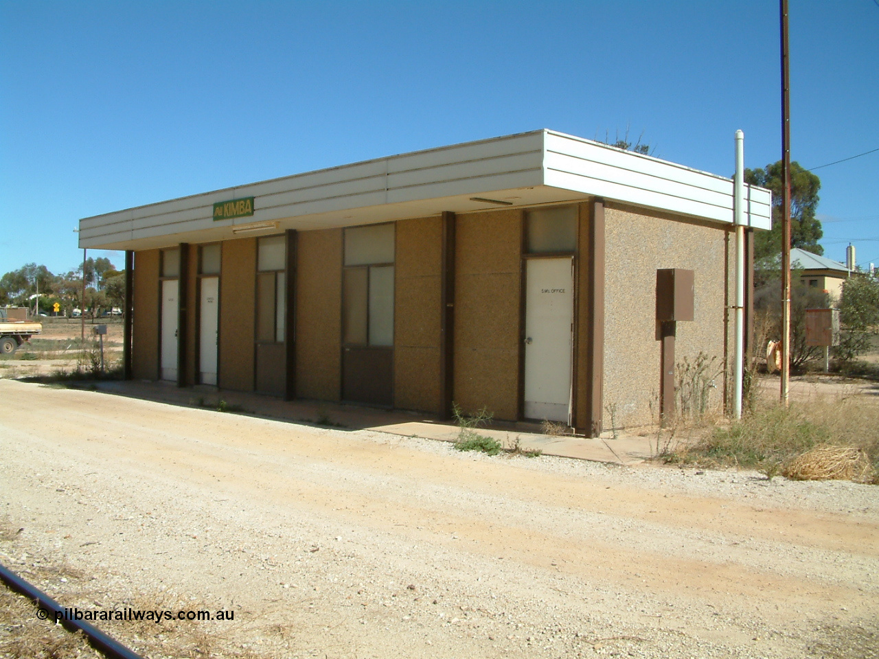 030411 110544
Kimba, station building with AN station sign, modern concrete pre-fab building style.
