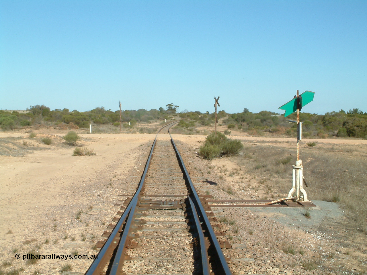 030411 160716
Cungena, looking south at Port Lincoln end of yard across stop sign protected grade crossing for Dickson Drive.
