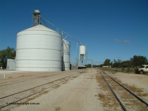 030411 110609
Kimba, view looking south of the Ascom Jumbo style silo complex, truck discharge on the left, outloading spout and silo over rail, horizontal bunker behind.
