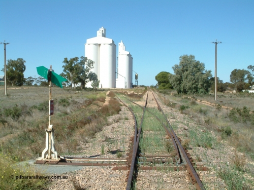 030411 141109
Nunjikompita, aboriginal word for 'burnt hair', located 357.6 km, terminus of line from 14th August 1914 until Thevenard extension opened on the 8th of February 1915, yard overview looking east from the western end of the yard. Concrete silo block 3 is closet to camera.
