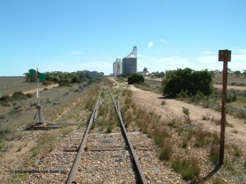 030411 141732
Nunjikompita, yard view looking west, Ascom style silo with loadout spout and silo, then a horizontal bunker and concrete silos. The truck unloading point is on the right of the silos.

