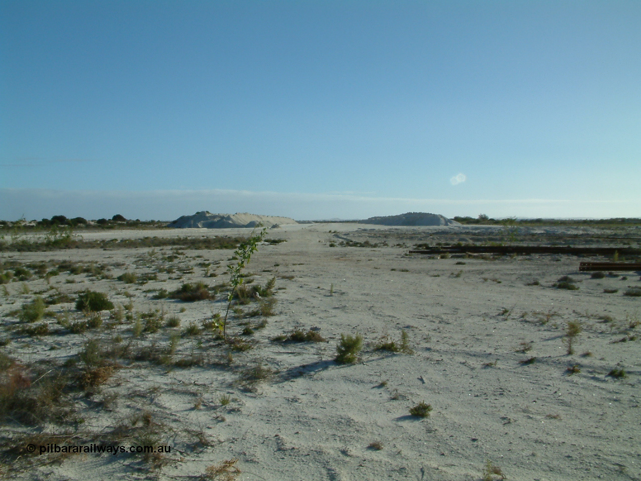 030414 163840
Kevin, , view looking west from inside the triangle at the west leg with gypsum stockpiles either side.
