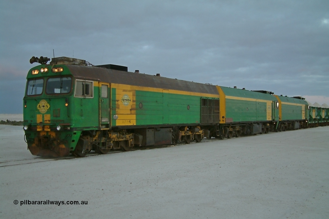 030415 065626
Kevin, loading is almost complete 0700 hrs. as gypsum train 3DD2 stands behind triple NJ class Clyde Engineering EMD JL22C model units NJ 5 serial 71-732, NJ 6 serial 71-733 and NJ 3 serial 71-730, these units built in 1971 at Clyde's Granville workshops started out on the Central Australia Railway for the Commonwealth Railways before being transferred to the Eyre Peninsula system in 1981. At the [url=https://goo.gl/maps/fjUHW]Kevin loading point[/url].
Keywords: NJ-class;NJ5;71-732;Clyde-Engineering-Granville-NSW;EMD;JL22C;