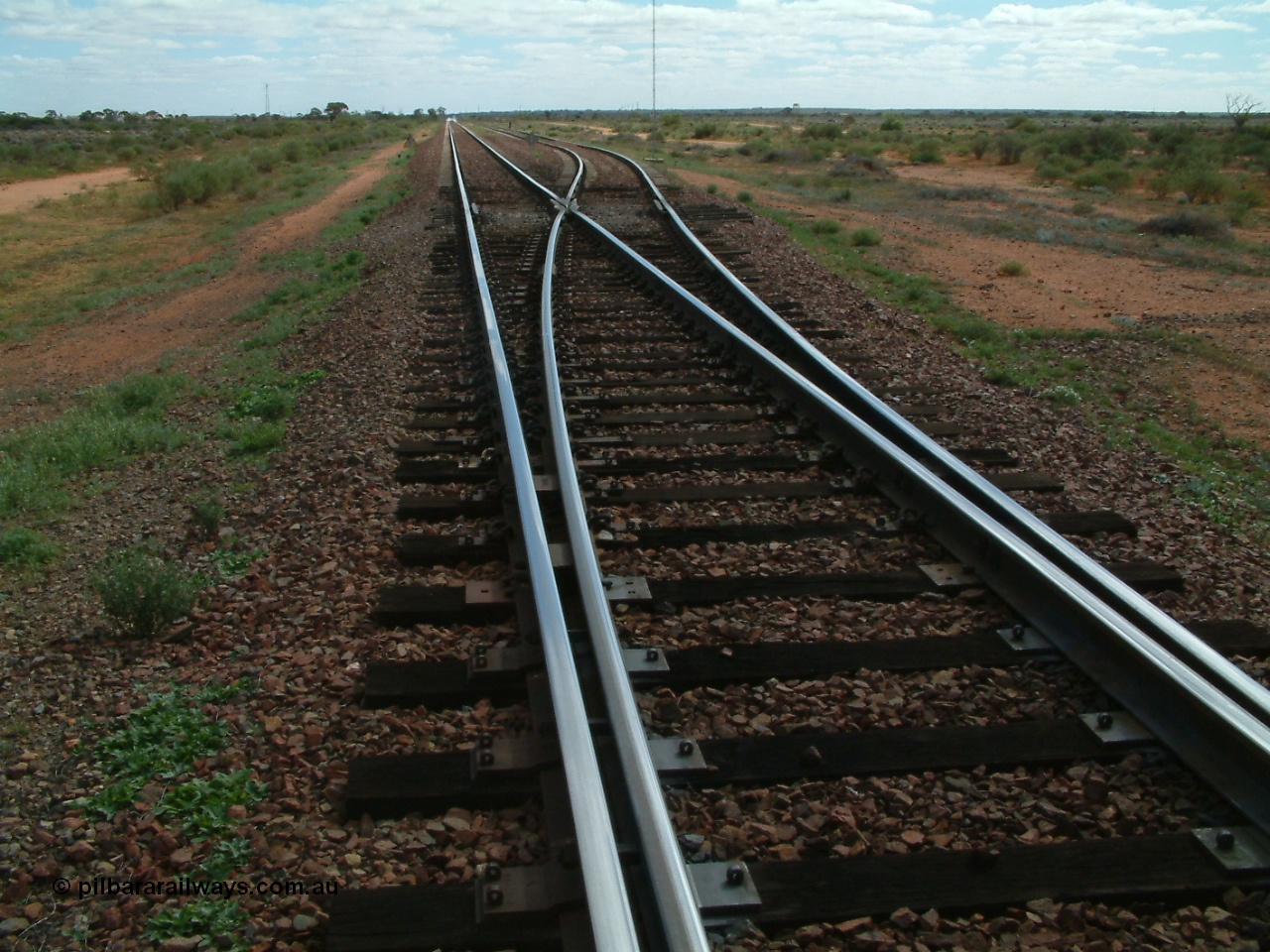 030415 135552
Kingoonya, located at the 426.5 km on the Trans Australian Railway, looking west at the timber section that carries the points or turnout and the concrete sleepers can be seen starting again. [url=https://goo.gl/maps/7TMcikXj33EqWvyCA]GeoData location[/url].
