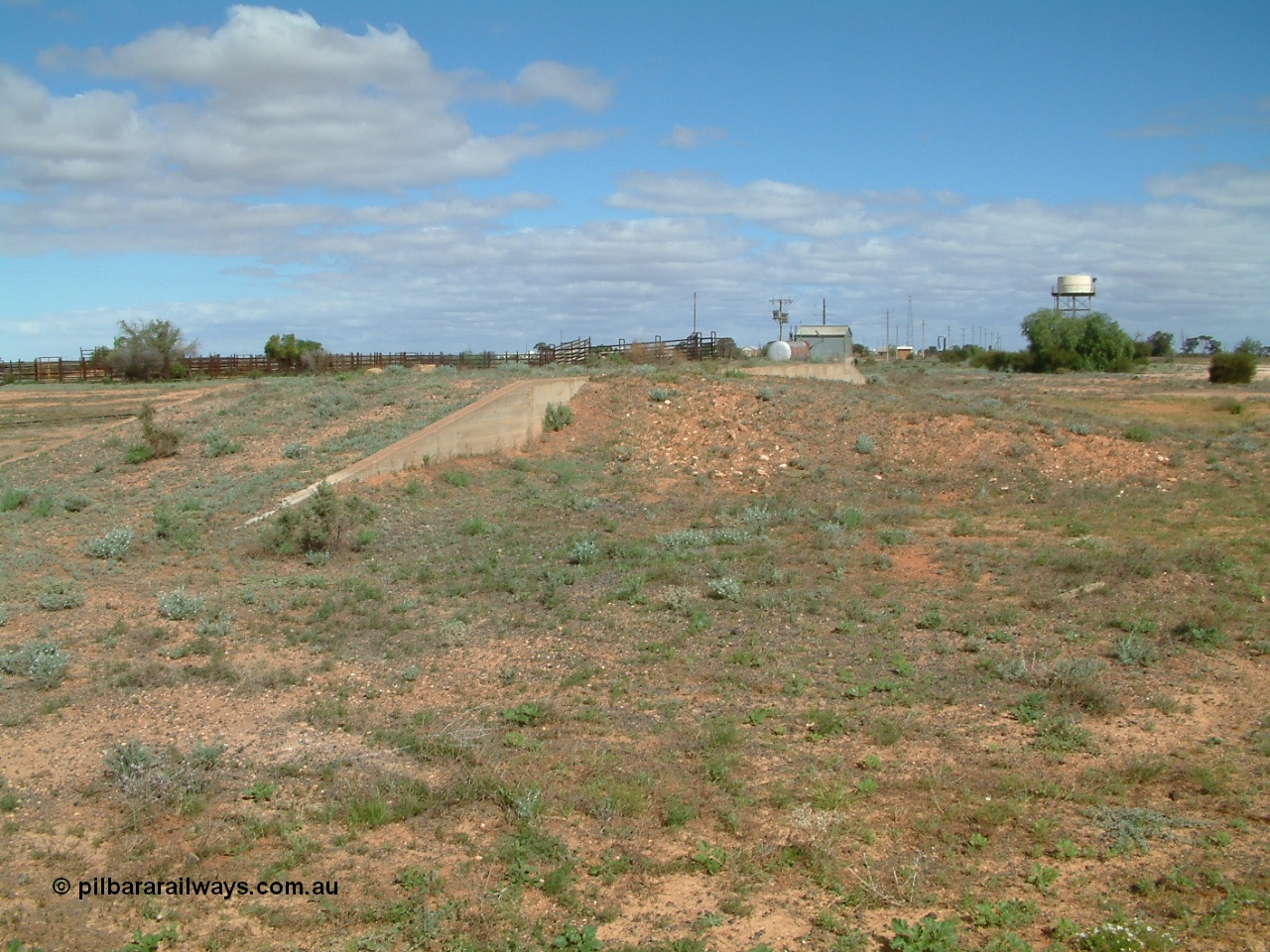 030415 141326
Kingoonya, located at the 426.5 km on the Trans Australian Railway, looking south with loading ramp, cattle yards and loading race, power station, standpipe and tanks stand. [url=https://goo.gl/maps/Tr6FpBMGRyvmQPcXA]GeoData location[/url].
