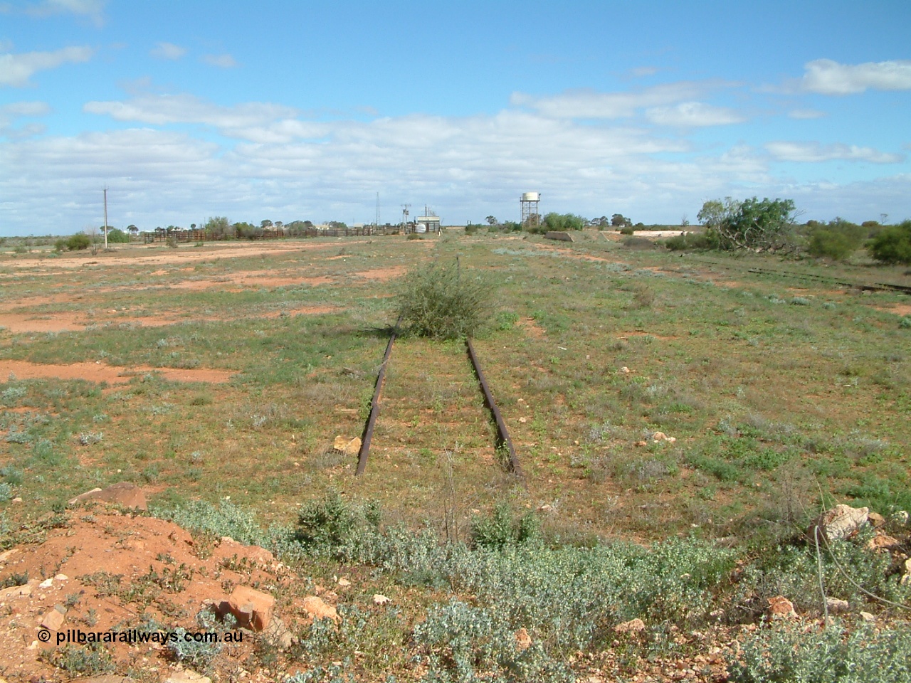 030415 141541
Kingoonya, located at the 426.5 km on the Trans Australian Railway, looking south with cattle yards and loading race, power station, standpipe and tanks stand all in the distance, loading ramp on the right. [url=https://goo.gl/maps/MeE2ay7UBV6jbHiR8]GeoData location[/url].
