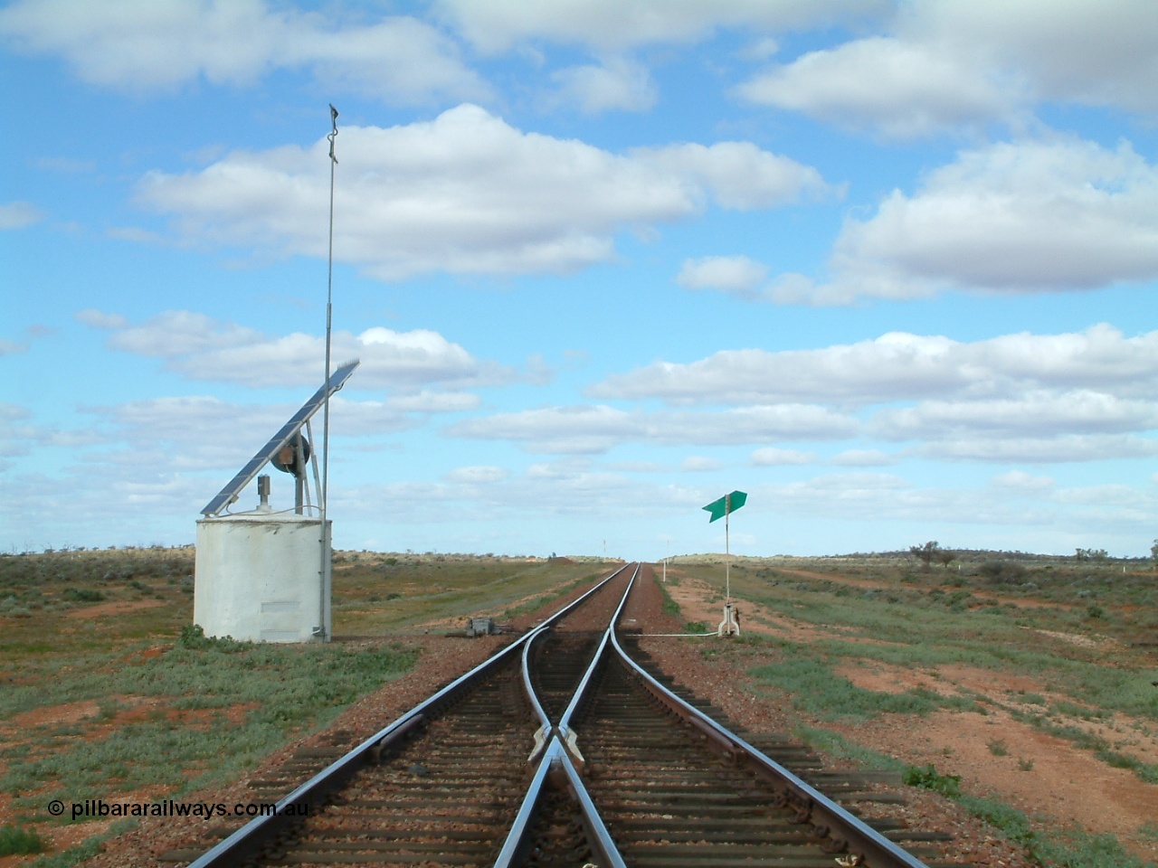 030415 150040
Ferguson, located at the 469 km on the Trans Australian Railway, looking east at the east end of the 1800 metre long crossing loop, point work on timber sleepers, interlocking hut with dual control point machine, indicator and lever on the right. [url=https://goo.gl/maps/XNaMGCNxZ4yv7Lrr9]GeoData location[/url].

