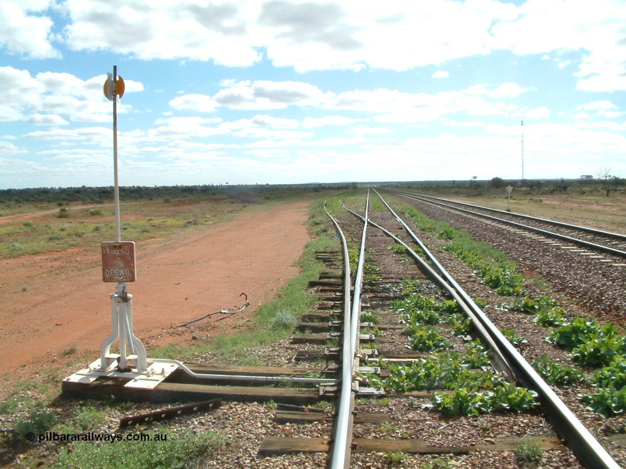 030415 150258
Ferguson, located at the 469 km on the Trans Australian Railway, looking west along the 1800 metre long crossing loop, siding point work on timber sleepers for goods siding with cattle race. [url=https://goo.gl/maps/XNaMGCNxZ4yv7Lrr9]GeoData location[/url].
