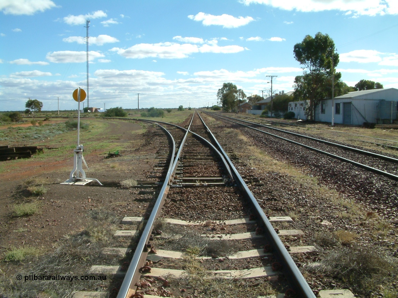 030415 154528
Tarcoola, at the 504.5 km, looking west along loop line, the eastern leg of the triangle running to the left, middle road is the Trans Australian Railway line while the right is the Central Australian Railway line. Tarcoola is the junction for the TAR and CAR railways situated 504 km from the 0 km datum at Coonamia. [url=https://goo.gl/maps/NmBNmrosE7e6d5gx8]GeoData location[/url]. 15th April 2003.

