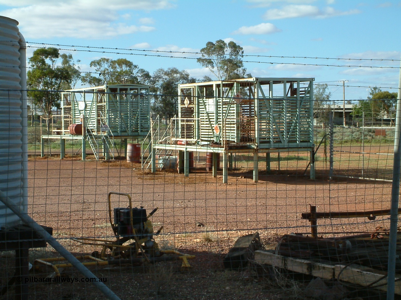 030415 155956
Tarcoola, at the 504.5 km, works compound see old livestock waggons converted to storage shed for gas bottles and the like. [url=https://goo.gl/maps/6oGe5dhUe3chHeB57]GeoData location[/url]. 15th April 2003.
