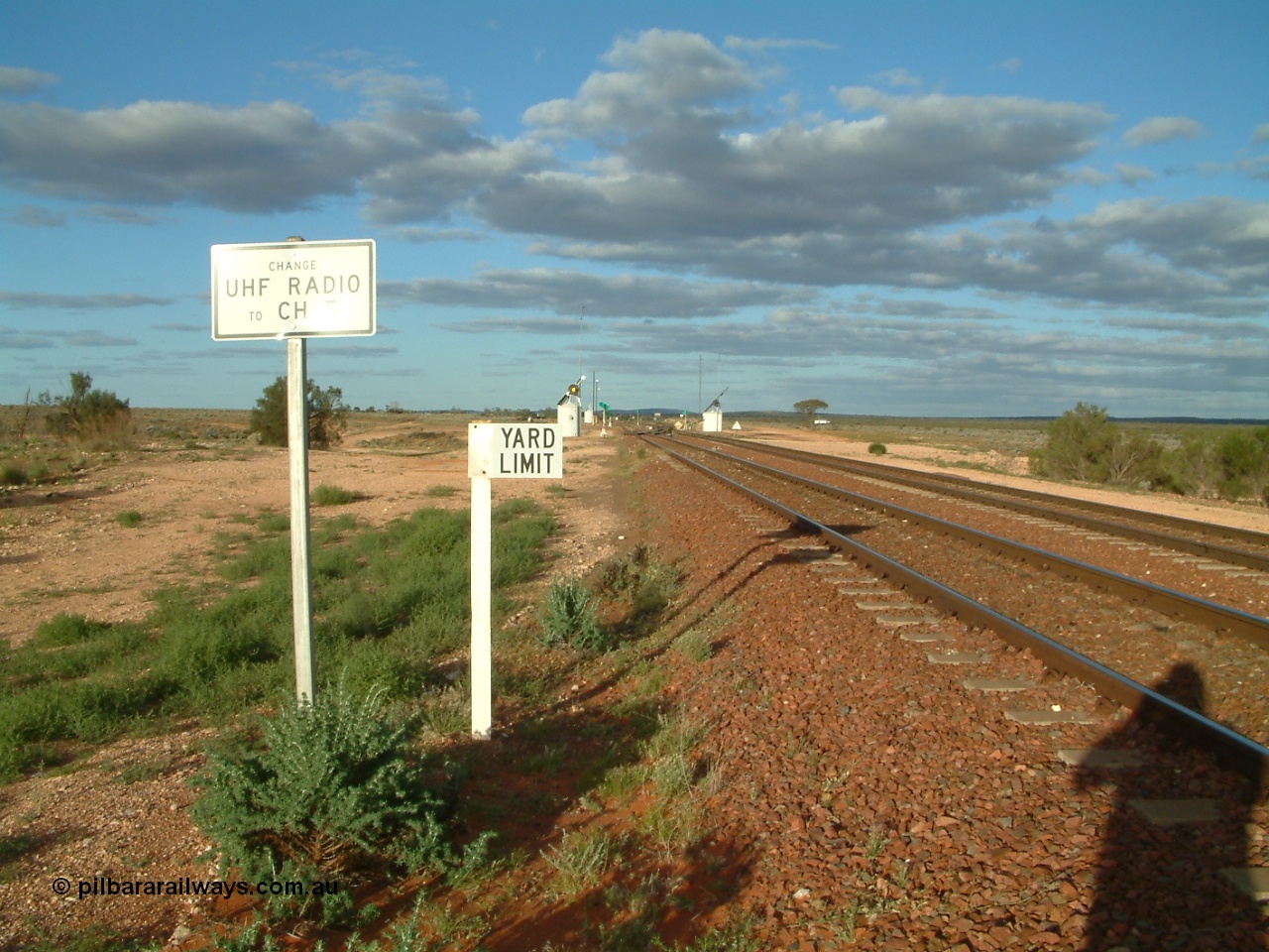 030415 171548
Tarcoola, at the 504.5 km, looking east along the Central Australian line at the western yard limit and radio channel change boards, Trans Australian line is on the right. Tarcoola is the junction for the TAR and CAR railways. [url=https://goo.gl/maps/vUPjQ7MxV2e9ndSY7]GeoData location[/url]. 15th April 2003.
