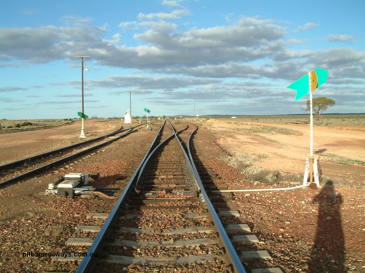 030415 171906
Tarcoola, at the 504.5 km, looking east along the Trans Australian line with the loop joining from the right and the Central Australian line on the left. Tarcoola is the junction for the TAR and CAR railways. [url=https://goo.gl/maps/qp85867GriDEnPyD7]GeoData location[/url]. 15th April 2003.
